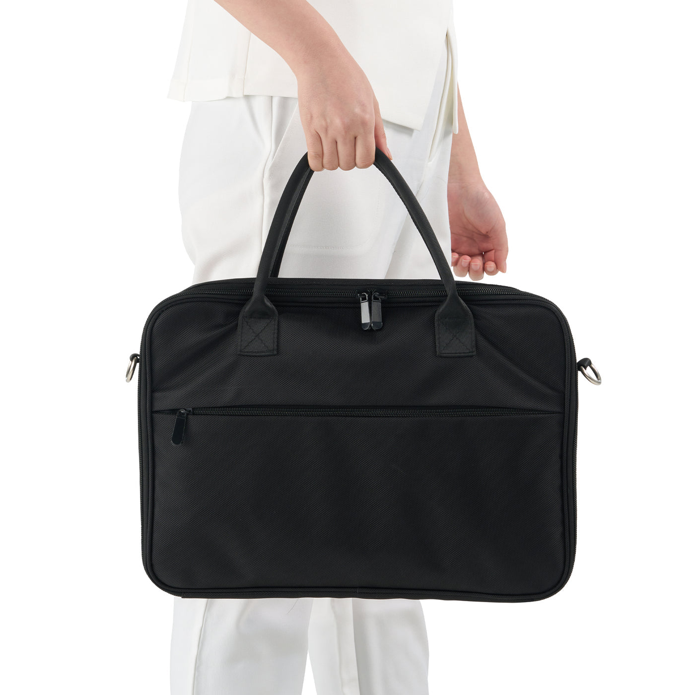 Person holding a black case against a white background