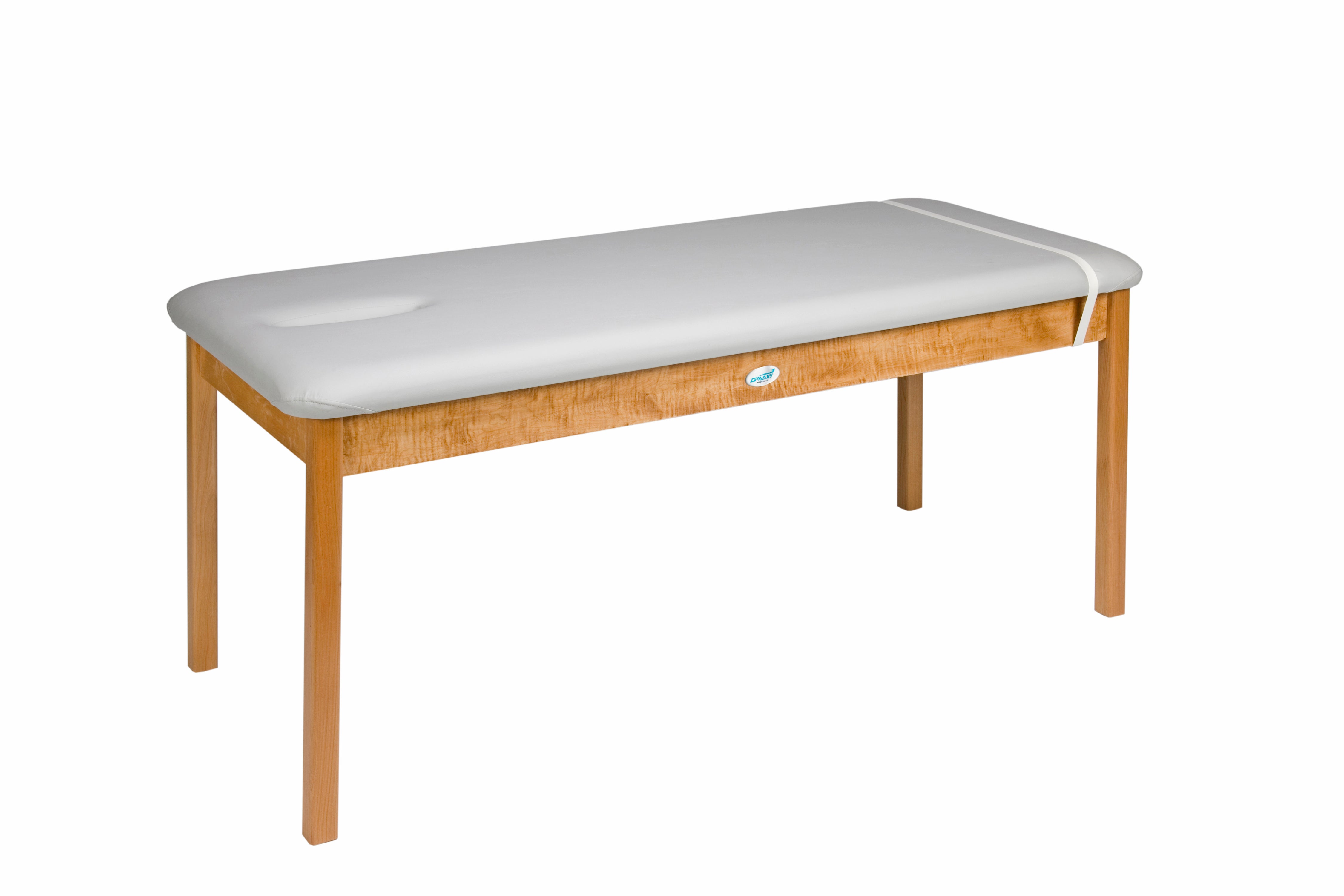 The Galaxy Mfg 1989-30 Treatment Table features a white padded top and face hole.