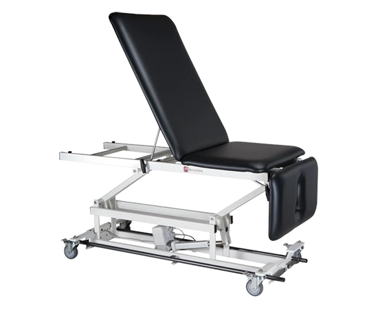 Armedica AM-BA 350 treatment table, three-section top, heavy-duty steel with wheels.