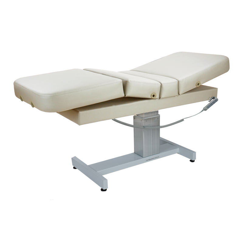 TouchAmerica VENETIAN POWERTILT Treatment Table with electric adjustable padded sections.