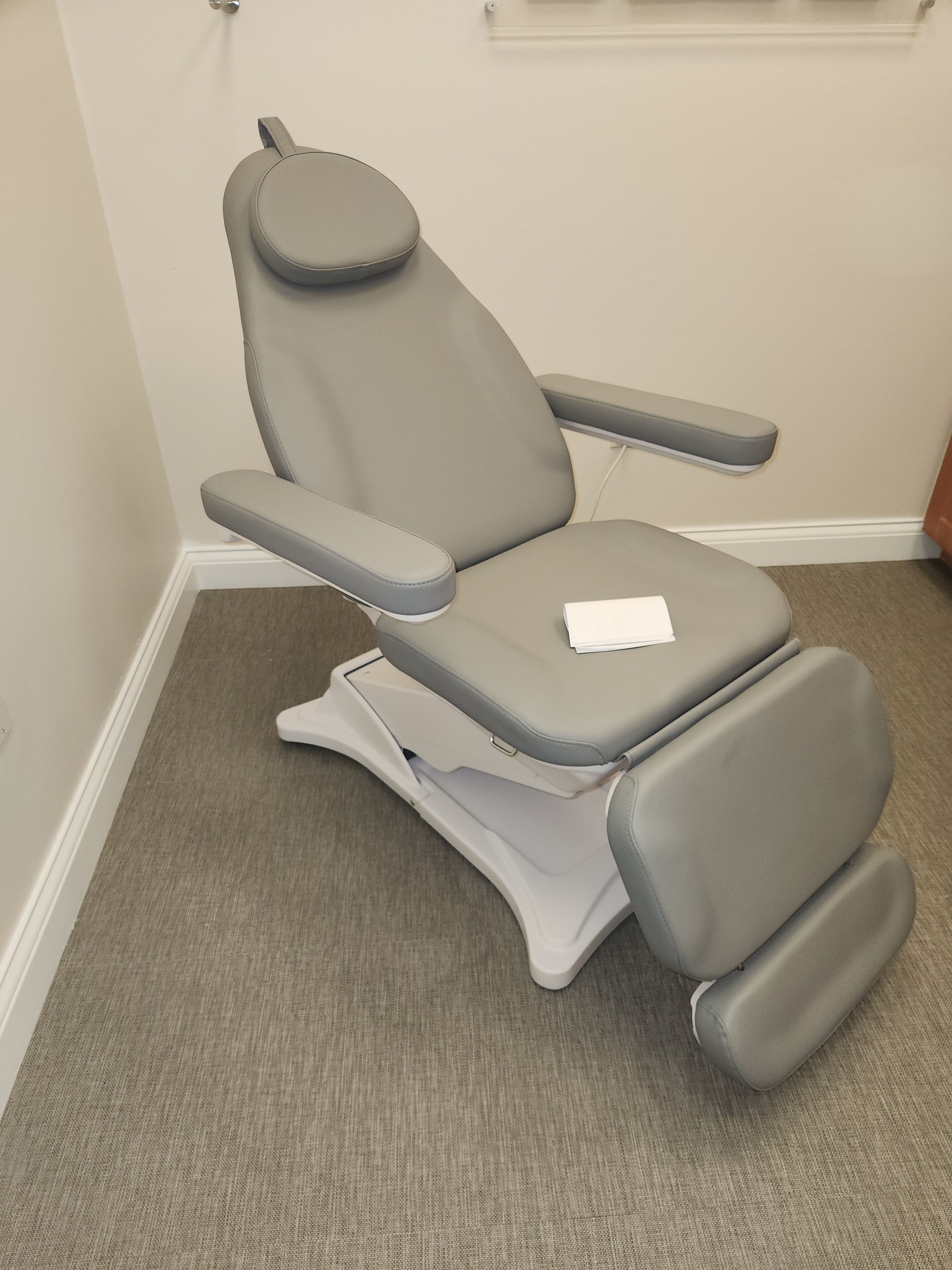 Bellucci Electrical Facial Bed DIR by DIR, gray with armrests, perfect for clinic beauty treatments.