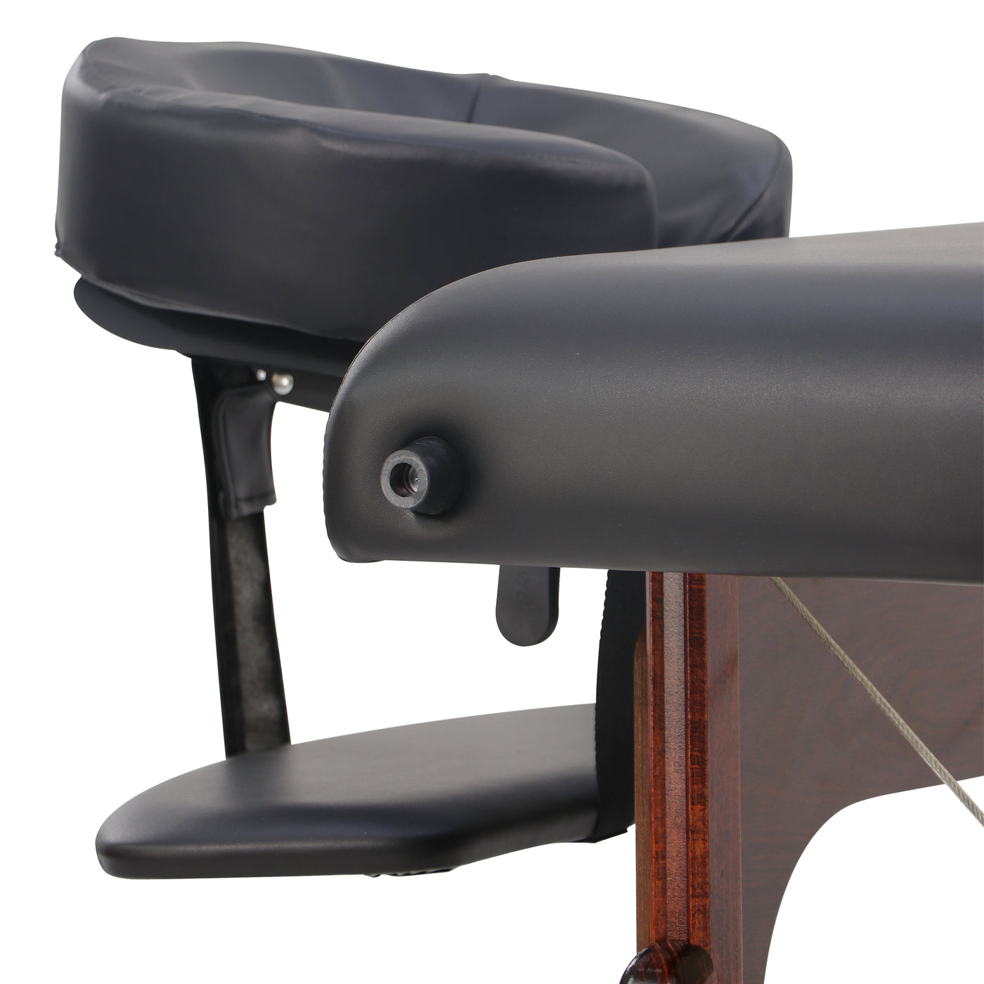 Close-up of a massage table with black padding on a white background