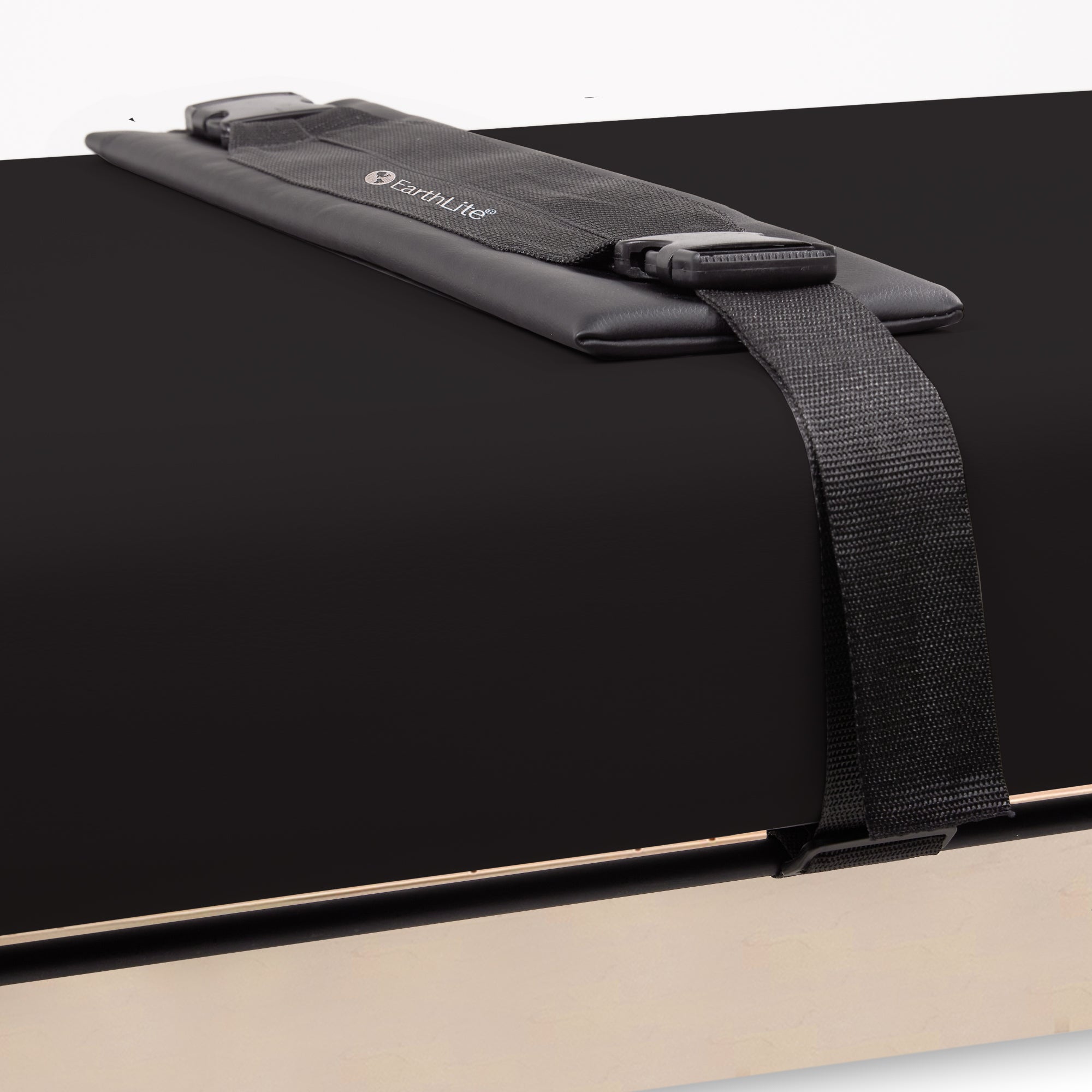 Black padded strap with buckle for EarthLite SEDONA FLAT Stretch Assist Massage Table system.