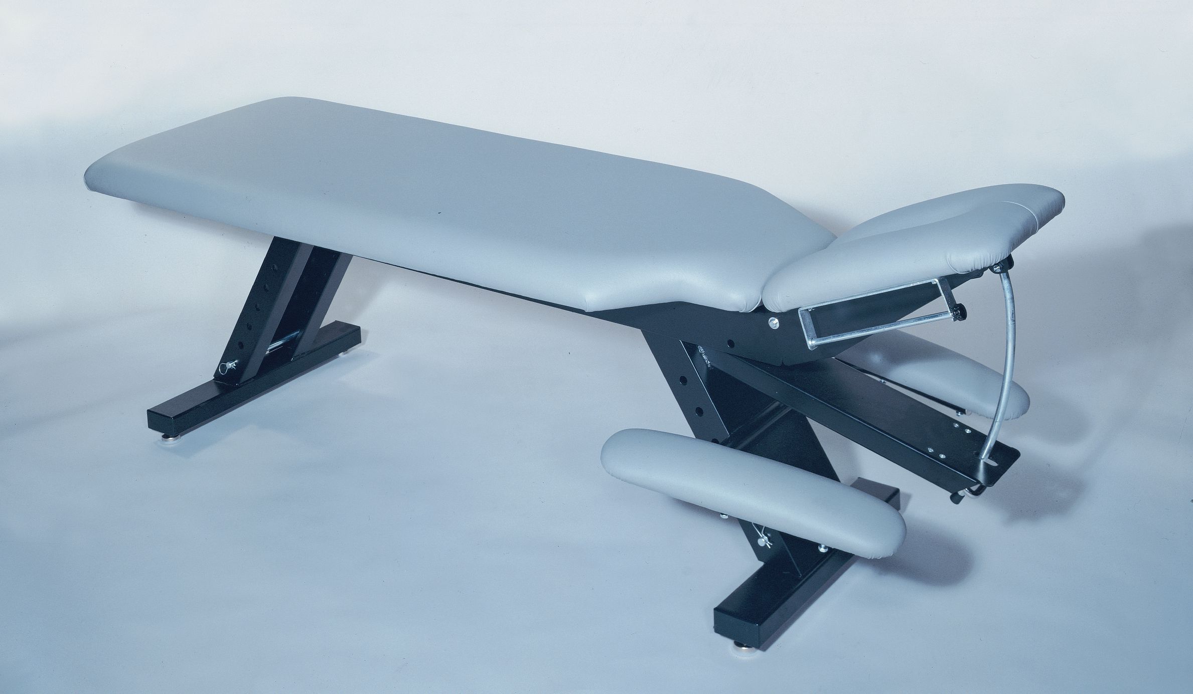 Galaxy Mfg 1996-CA adjustable table with arm rest and sturdy metal frame.
