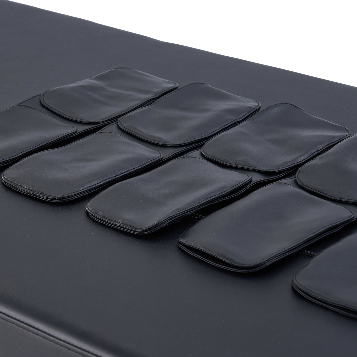 Close-up of Master Massage AirMaster padded sections on the stationary massage table surface.