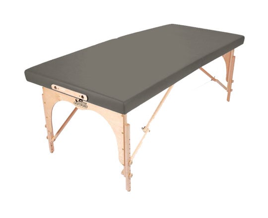 Custom Craftworks ALEXANDER TECHNIQUE portable table with wooden legs and a gray padded surface.