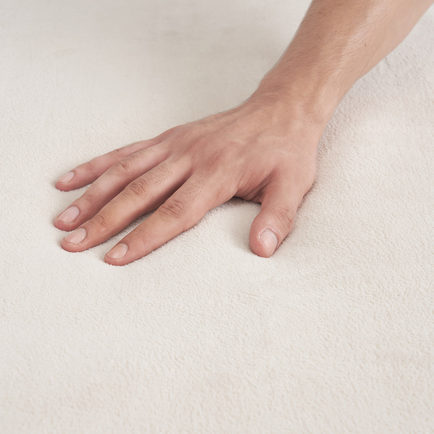 Hand resting on Master Massage Table WARMING PAD