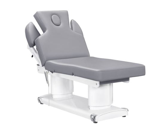 The DIR Luxi 4 Motors gray medical spa chair features headrest, armrests, and a white base.