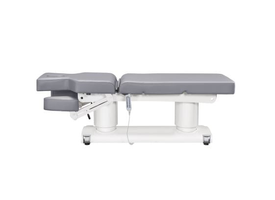 Luxi 4 Motors Medical Spa Treatment Table by DIR—adjustable gray bed with headrest and remote.