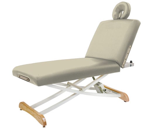 Buff massage table with wooden legs on a white background