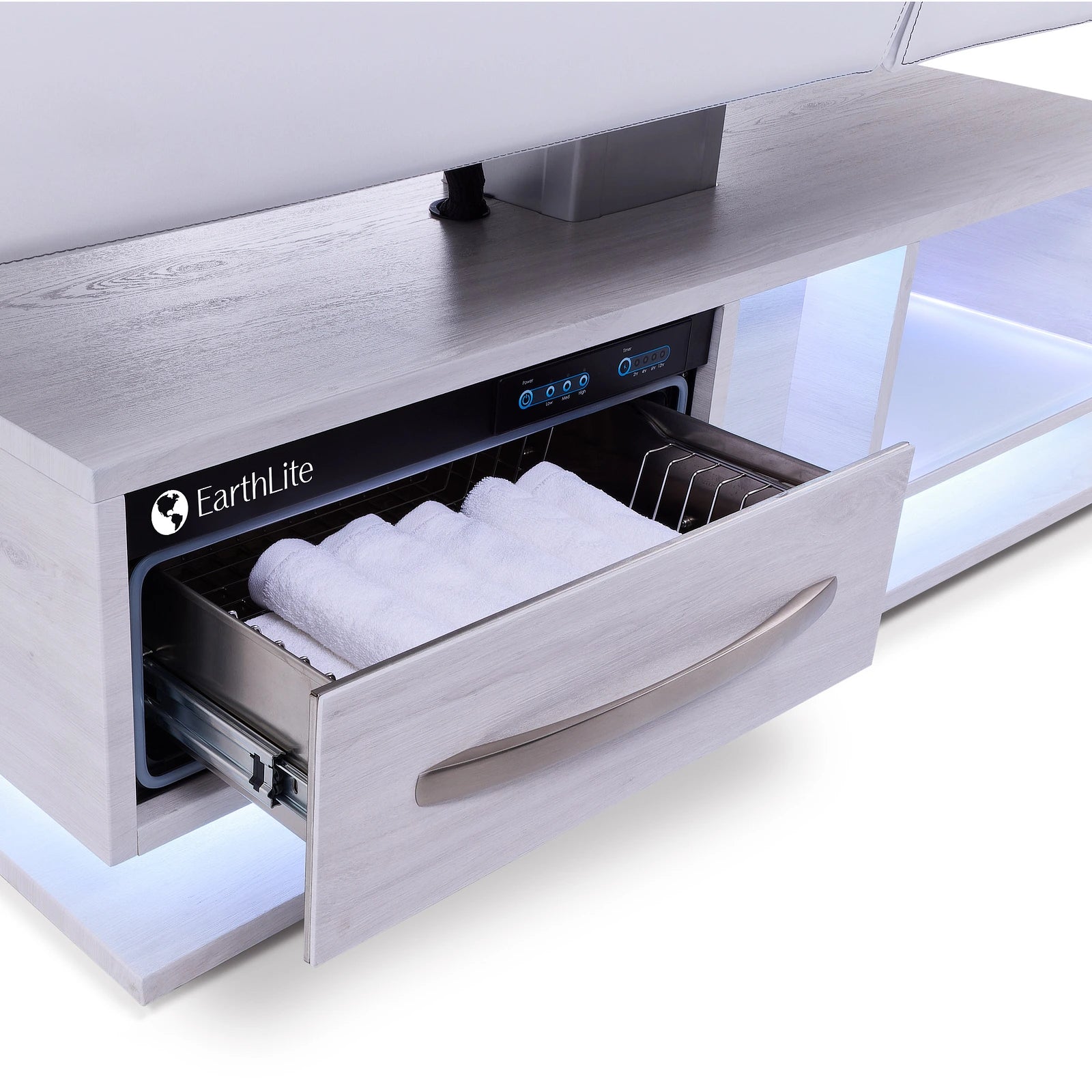 An EarthLite-labeled drawer holds towels under an Earthlite EVEREST ECLIPSE 2.0 table with LEDs.