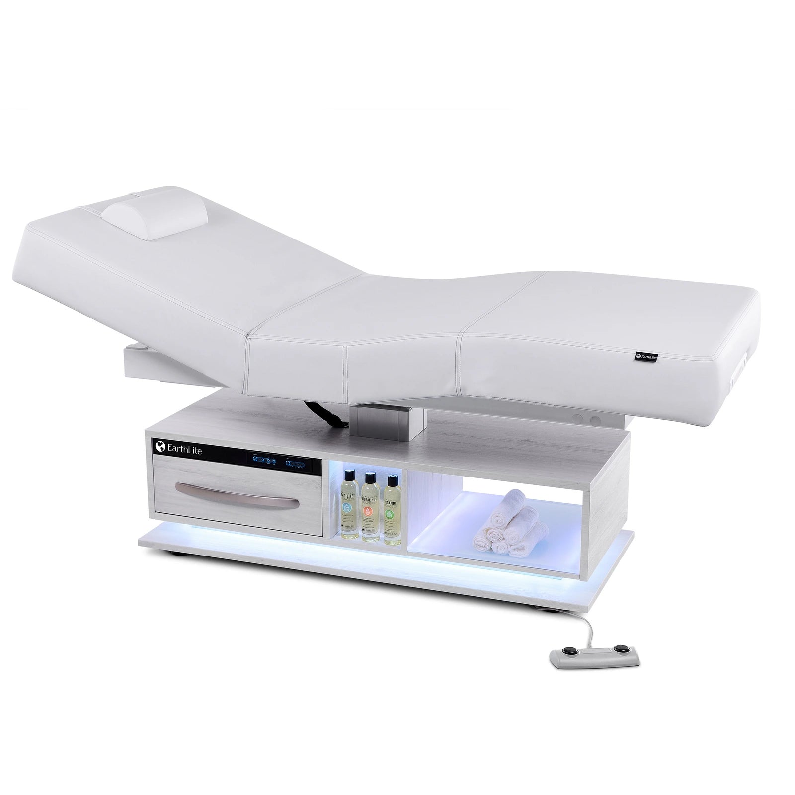 EarthLite EVEREST ECLIPSE 2.0 salon massage table with shelves, towels, bottles, remote; spa ready.