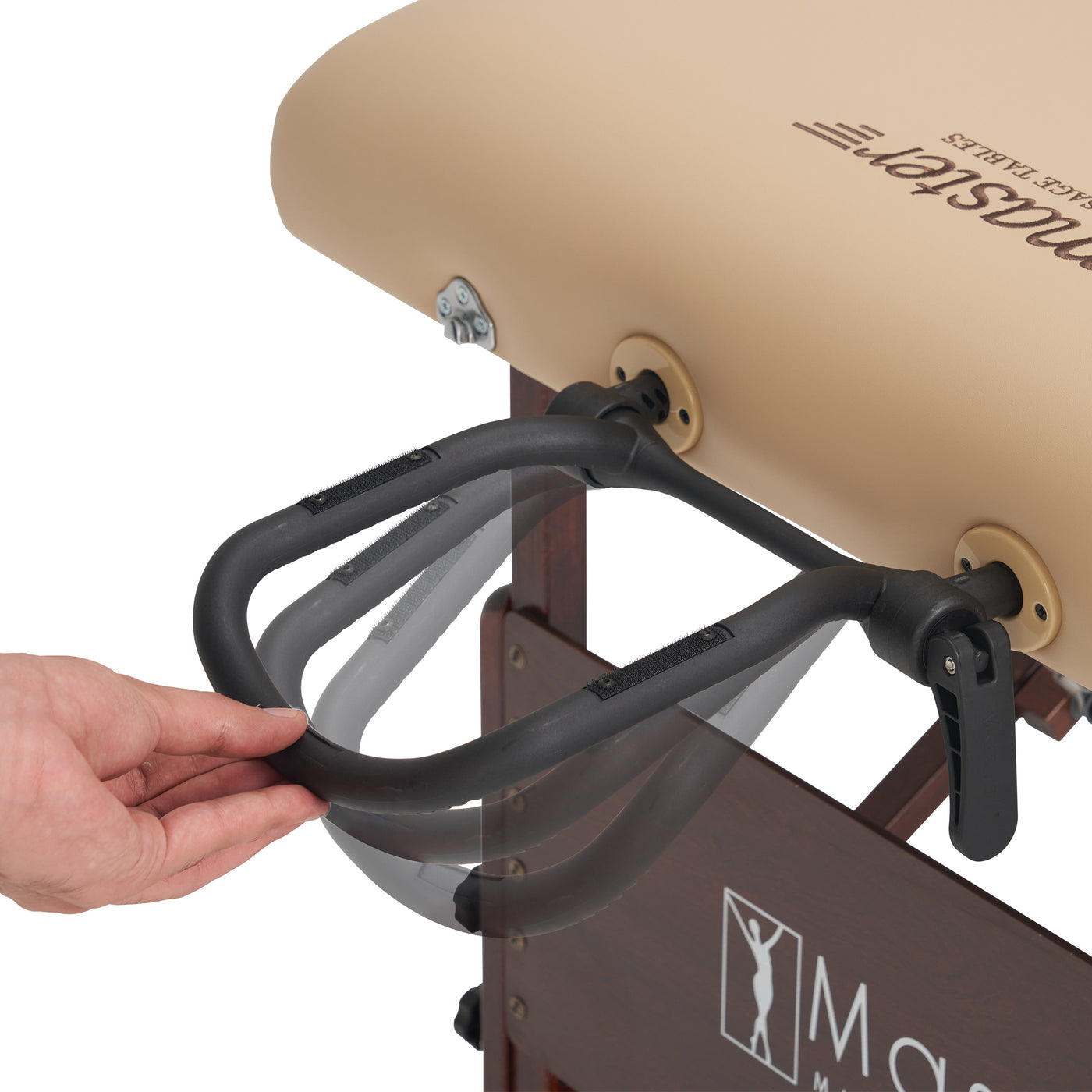 Hand adjusting a black face cradle on a massage table with 'Master Massage' branding.