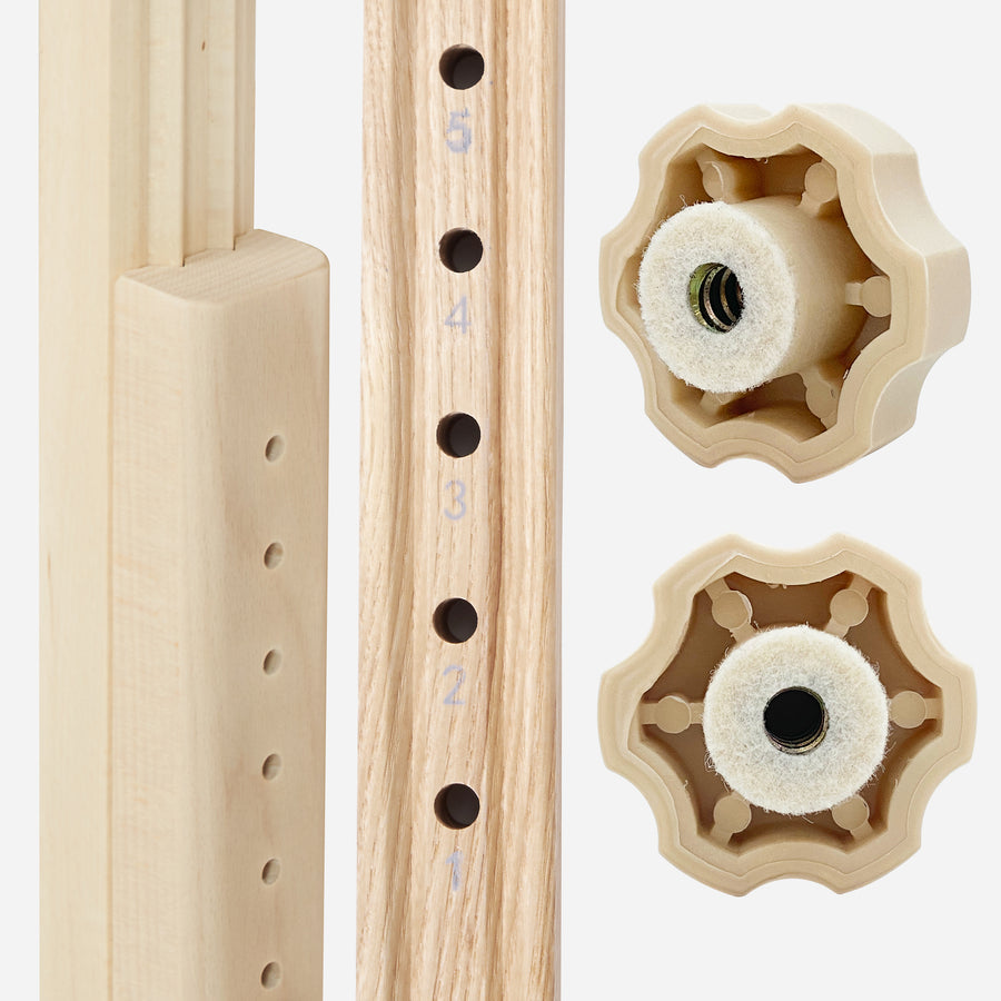 Close-up of MT Massage HARVEY Tableās adjustable wooden frame with numbered holes and knobs.