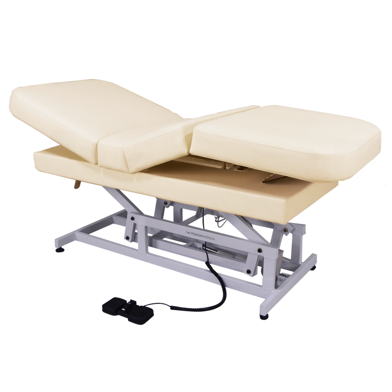 TouchAmerica HILO MULTIPRO beige ADA table with electronic controls and foot pedals.