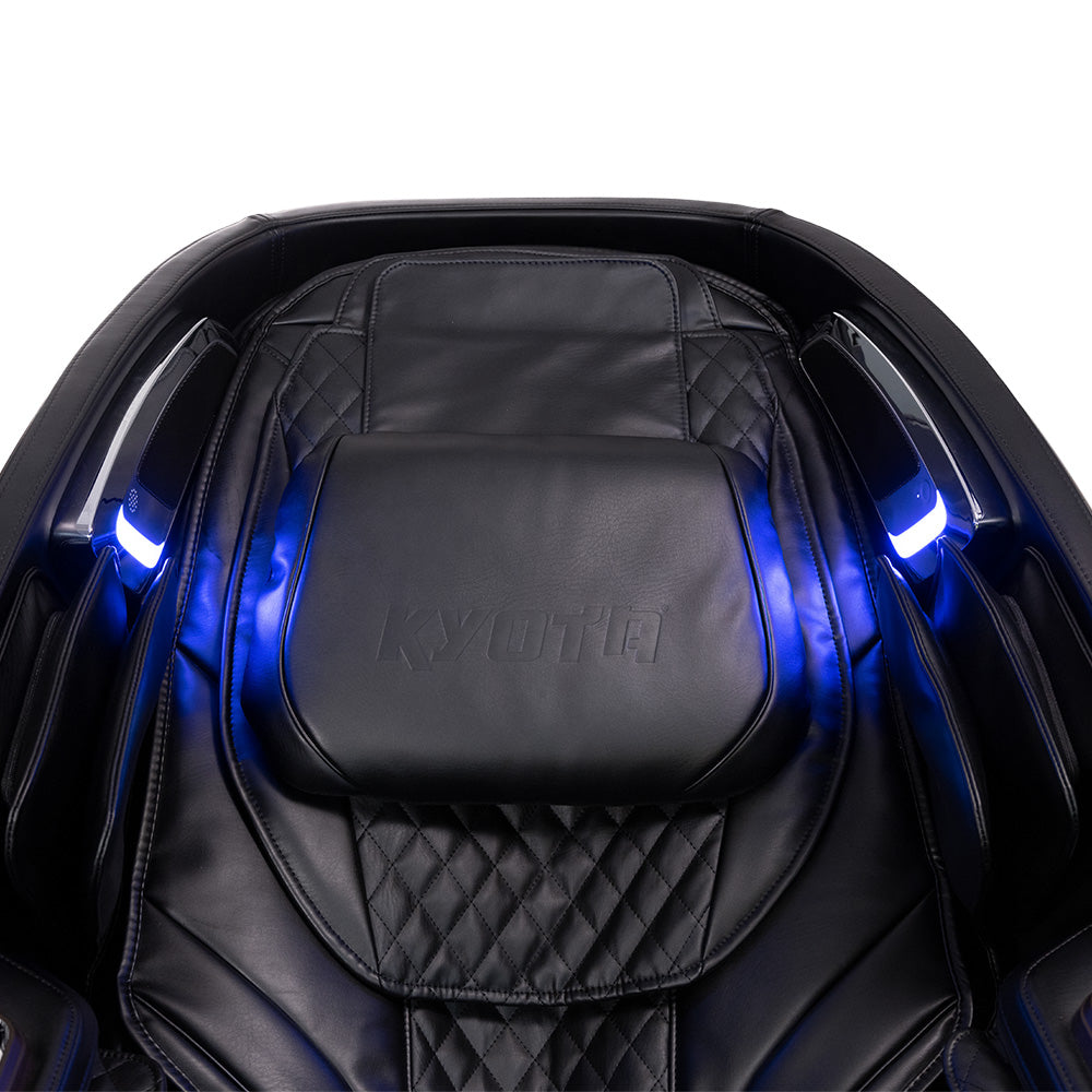 Kyota Nokori M980 Syner-D massage chair in black leather with quilted design and blue LED lights.