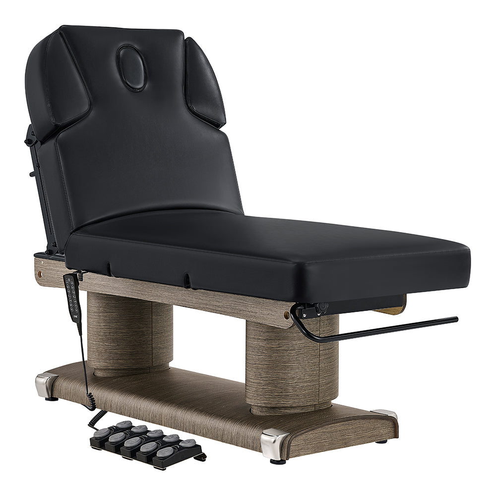 Black massage table with wooden base on a white background