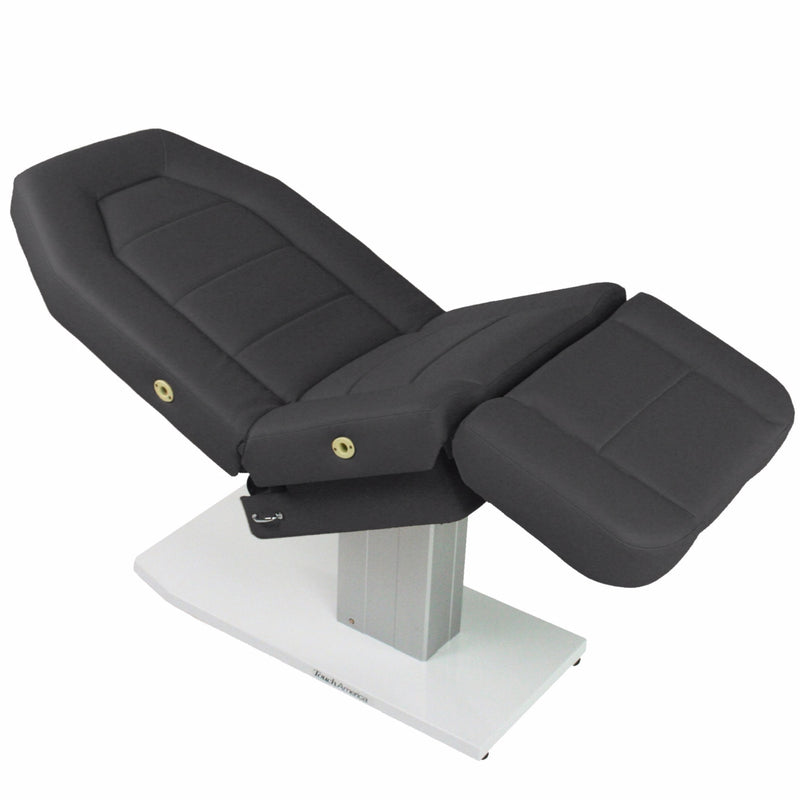 TouchAmerica MARIMBA Treatment Chair/Table with cushioned sections for comfortable facials.