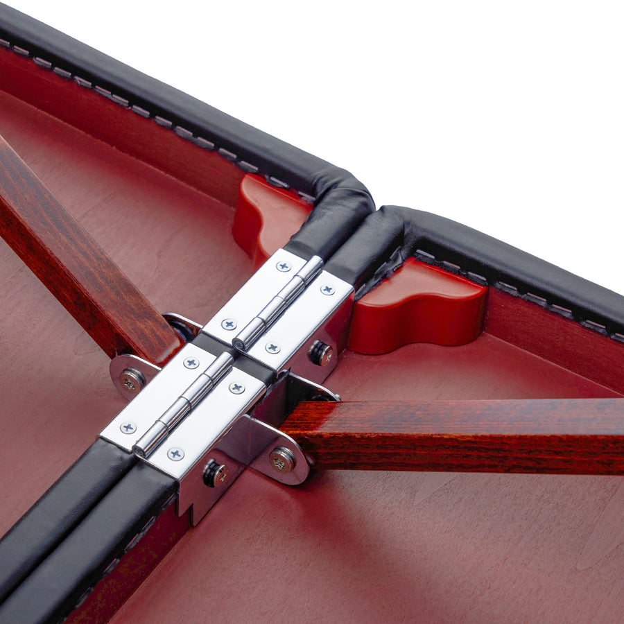 Close-up of metal hinges and red joints inside the Master Massage MONTCLAIR Therma-Top table.
