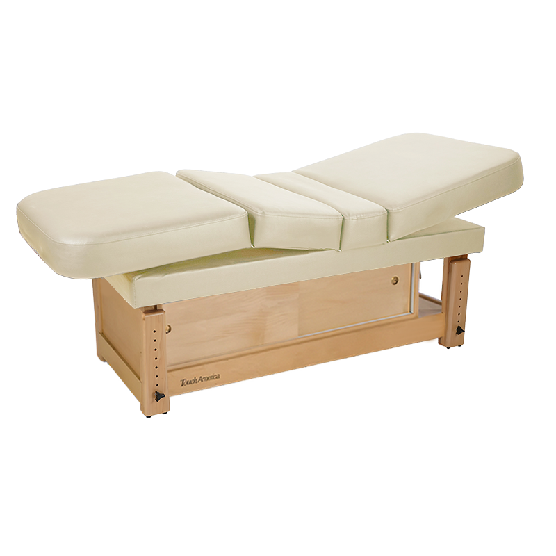 TouchAmerica STATIONARY MULTIPRO Treatment Table with wood base and storage compartment.