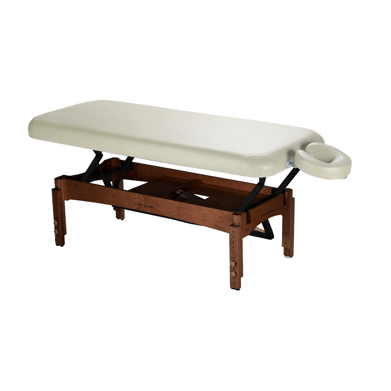 TouchAmerica OLYMPUS FLAT Electric Lift Table with cream top and attached face cradle.
