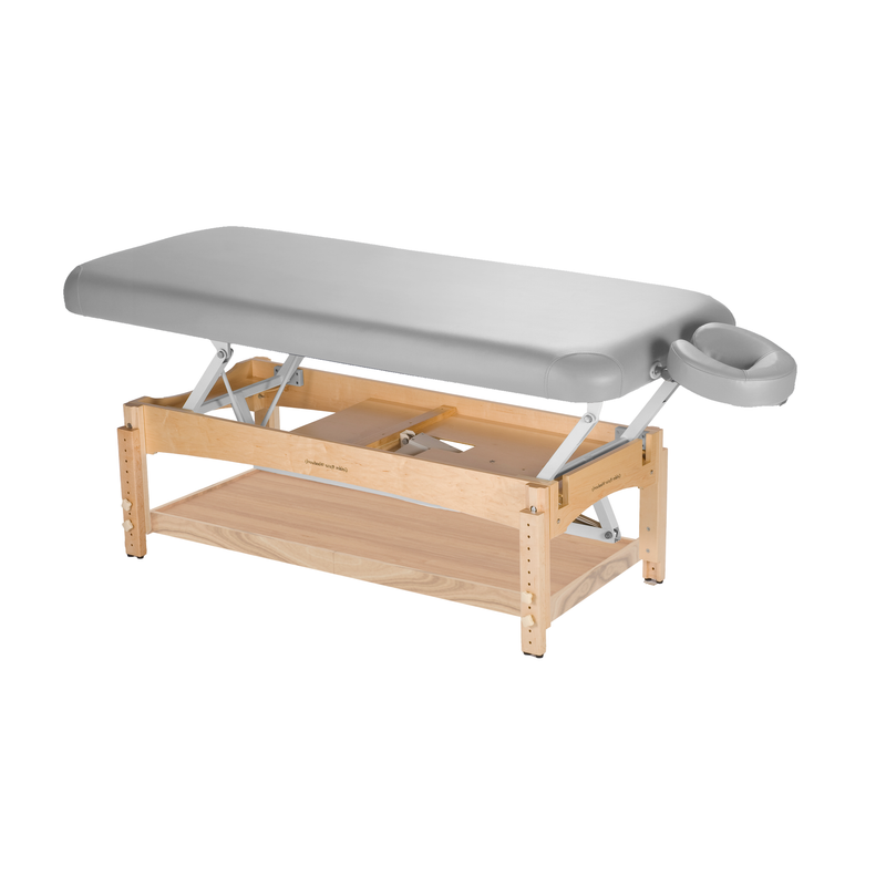TouchAmerica OLYMPUS FLAT electric lift table with gray padding and adjustable headrest.
