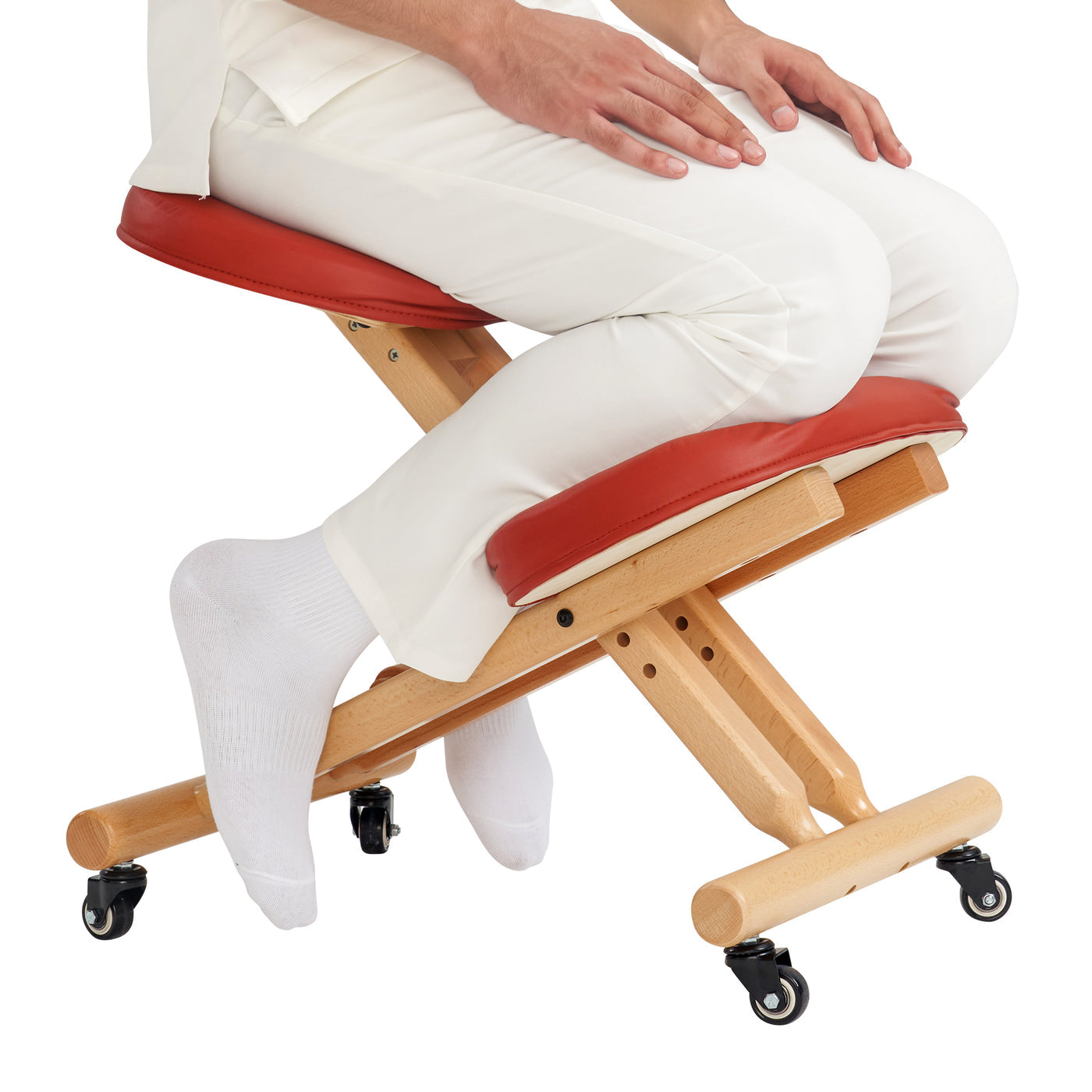 Person sitting on a wooden kneeler with cinnamon cushion on a white background