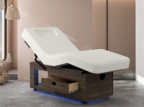 Oakworks Prema E-nvi electric spa table with storage drawer and adjustable salon top.