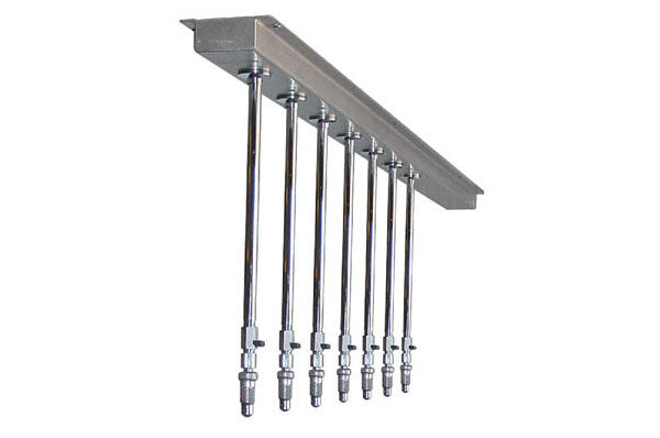 Water Werks Torrent 7-Head Vichy Shower with 94” arm, spa-style vertical pipes on bracket.