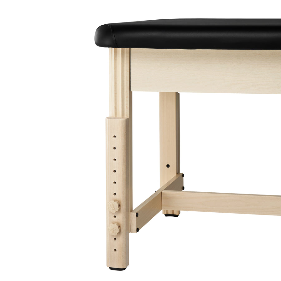 Close-up of an MT HARVEY Stationary Massage Table leg with height knobs and durable upholstery.