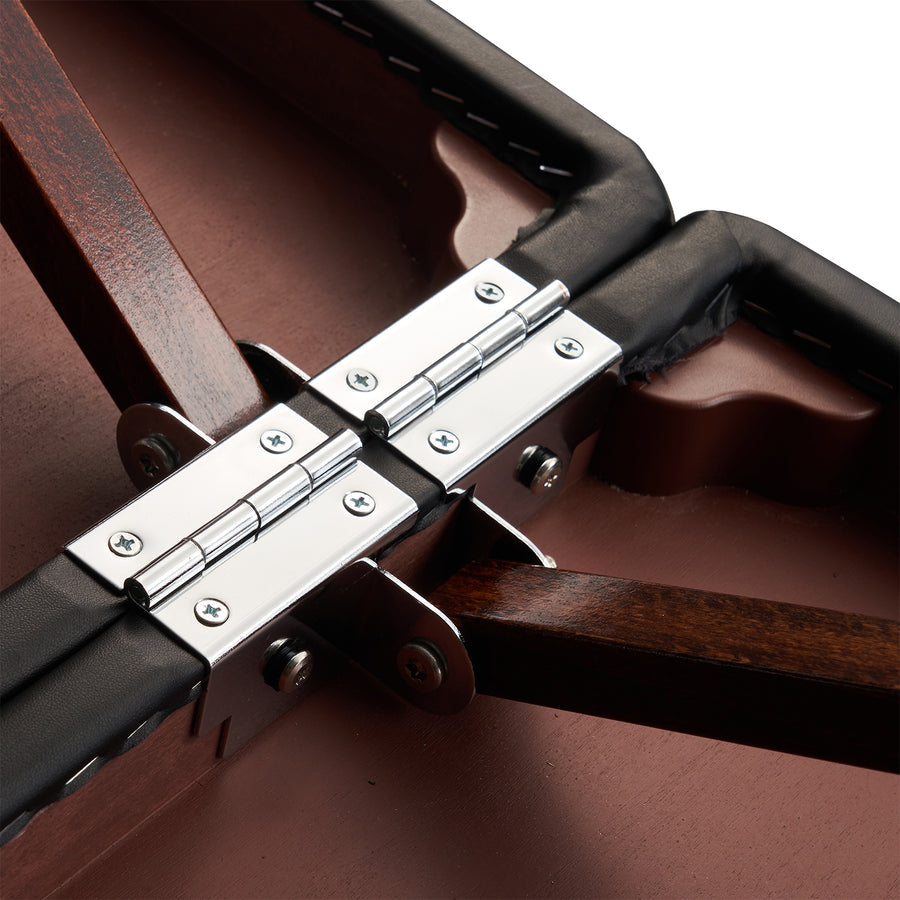 Close-up of a metal hinge on Master Massage ROMA Portable Table with THERMA-TOP surface.