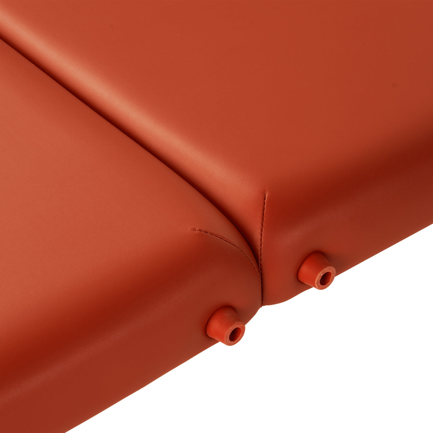 Close-up of orange cushions with seams on the Master Massage FAIRLANE Portable Massage Table.