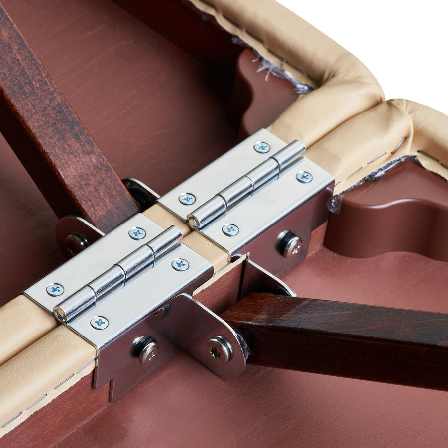 Metal hinge joins padded wooden sections on Master Massage DEL RAY Portable Massage Table.