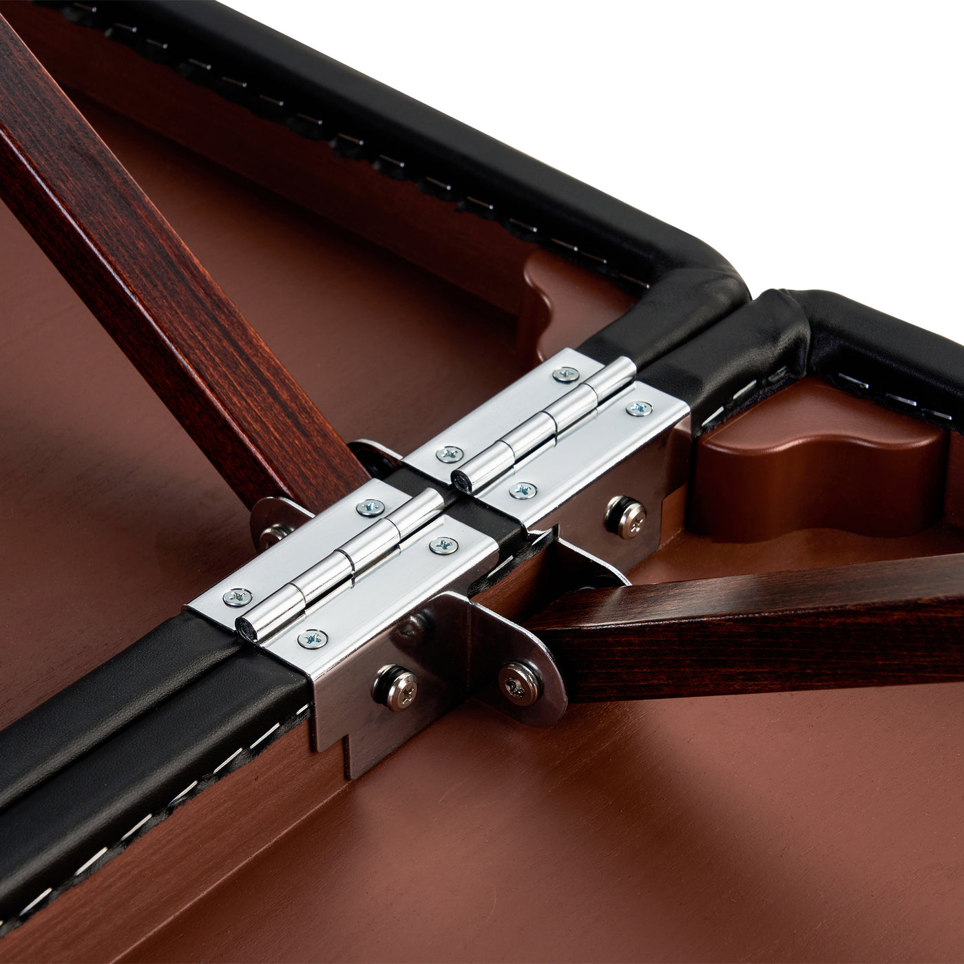 Close-up of hinges on Master Massage DEL RAY Portable Table joining wooden panels with black trim.