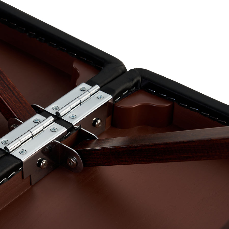 Close-up of metal hinges on the Master Massage NEWPORT Portable Massage Table’s wood sections.