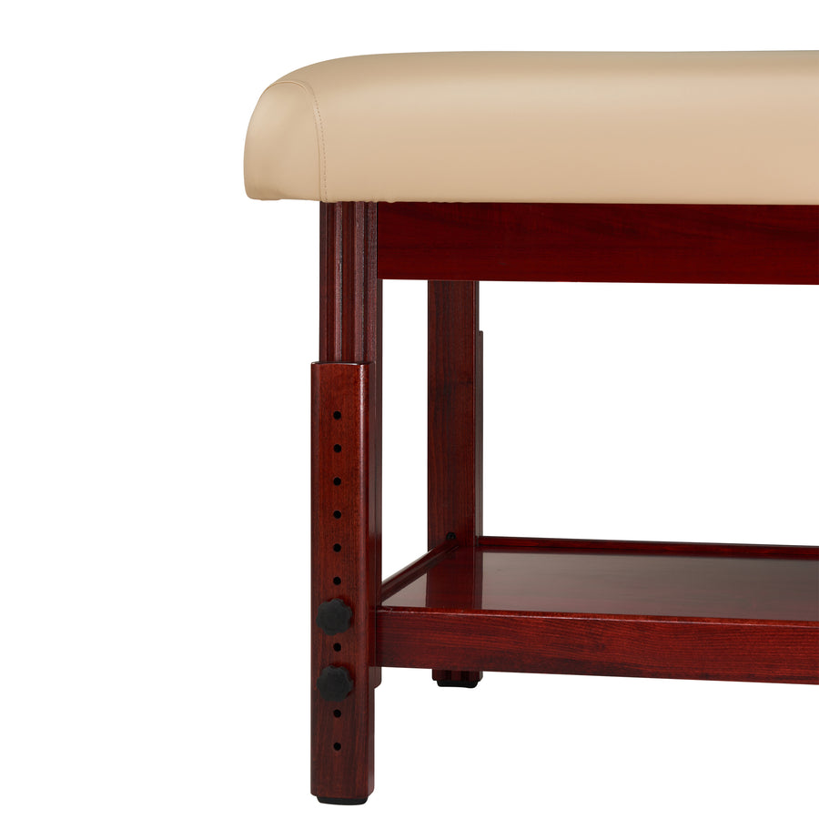 Close-up of Master Massage SPAMASTER Stationary Table with beige cushion and adjustable height.