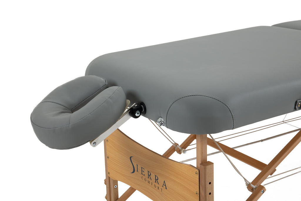 Sierra Comfort Premium Wide portable massage table with face cradle and wooden legs.
