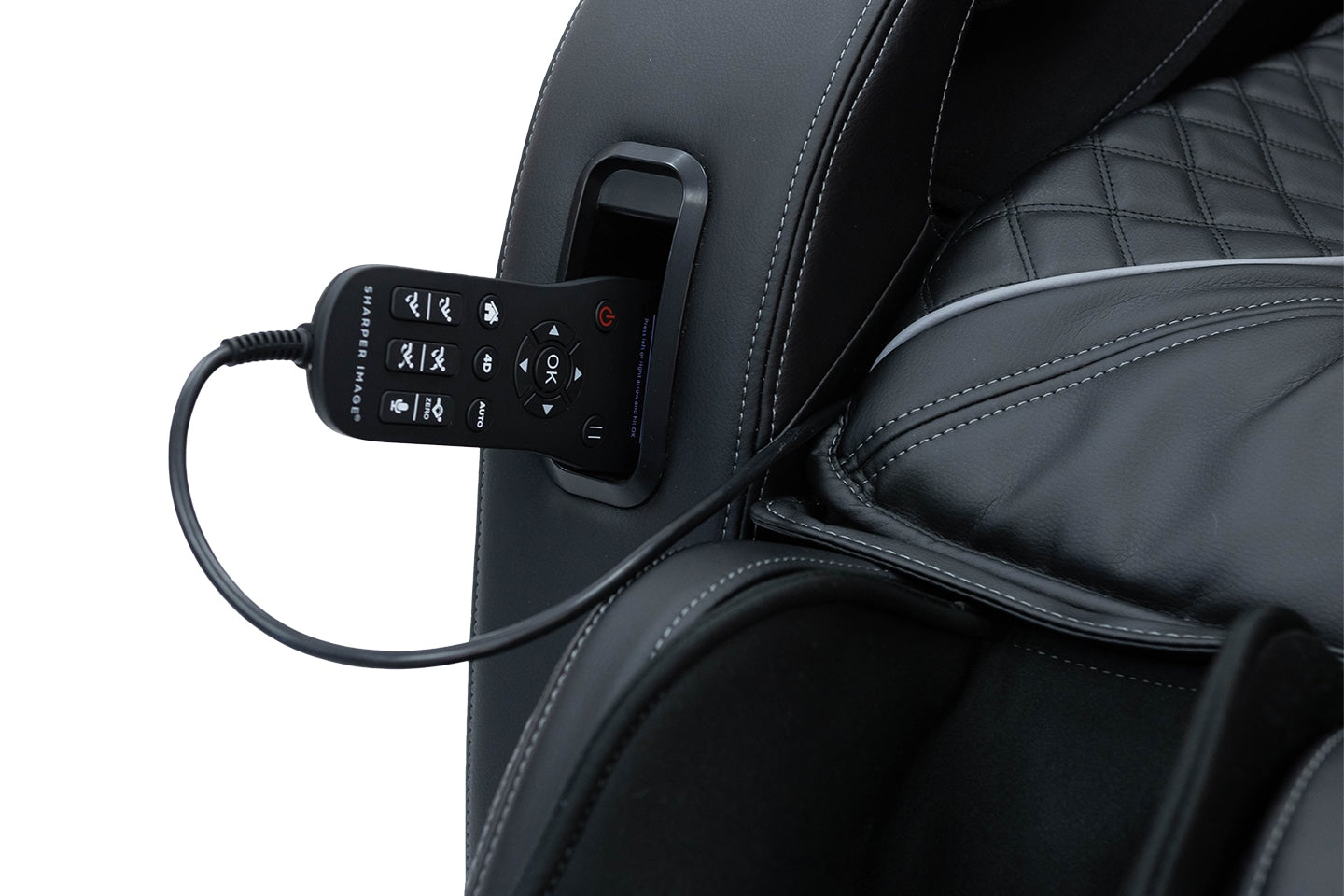 Sharper Image Axis 4D Massage Chair in black with remote and quilted seat upholstery shown.