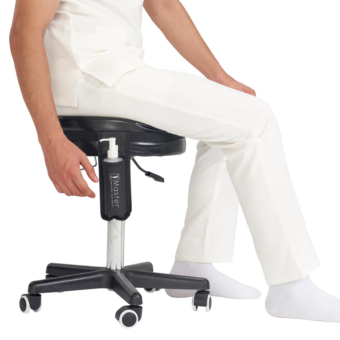 Person sitting on a black adjustable stool with Master Massage Single Bottle Massage Oil Holster Case Bag