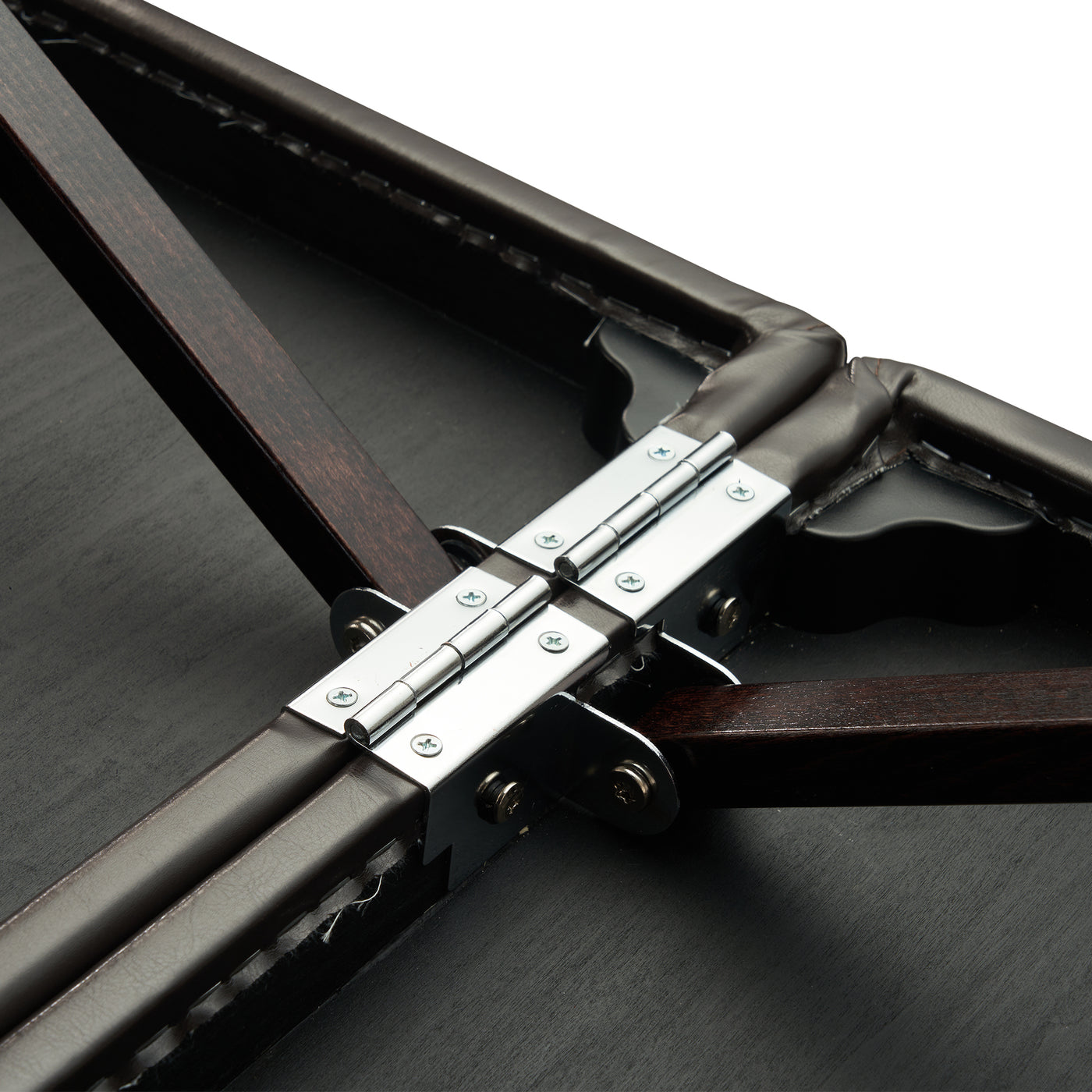 Close-up of hinge on Master Massage SUPREME LX portable table connecting two wood panels.