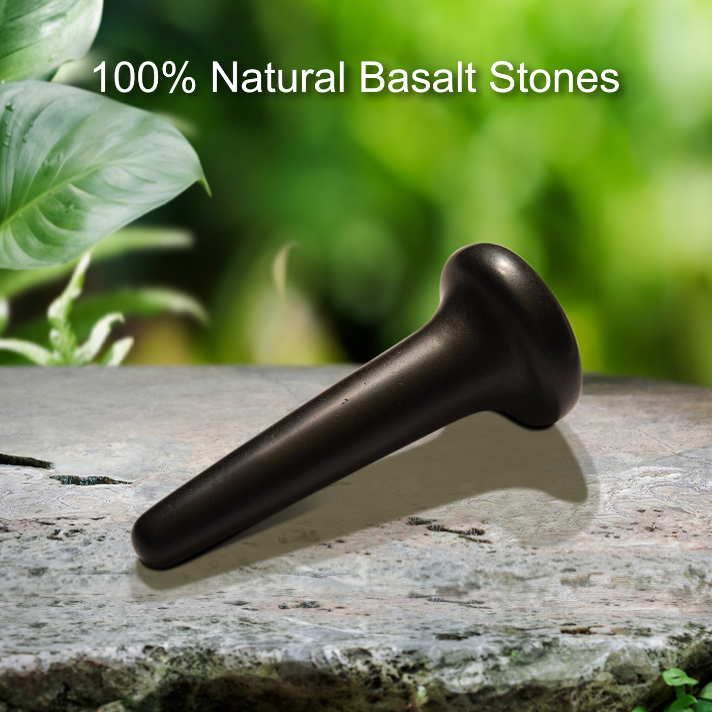 MT Massage Basalt Nail Shape Hot Stone Massage Trigger Point Tool with greenery in the background