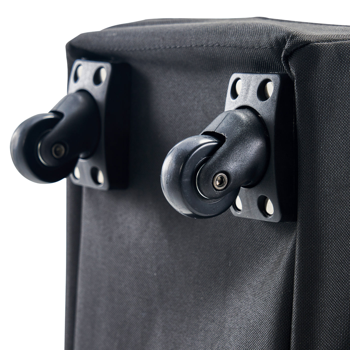 Close-up of black carry case wheels on a white background