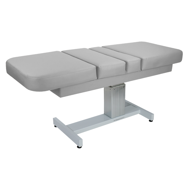 TouchAmerica VENETIAN MULTIPRO—a gray adjustable spa treatment table with cushioned surface.