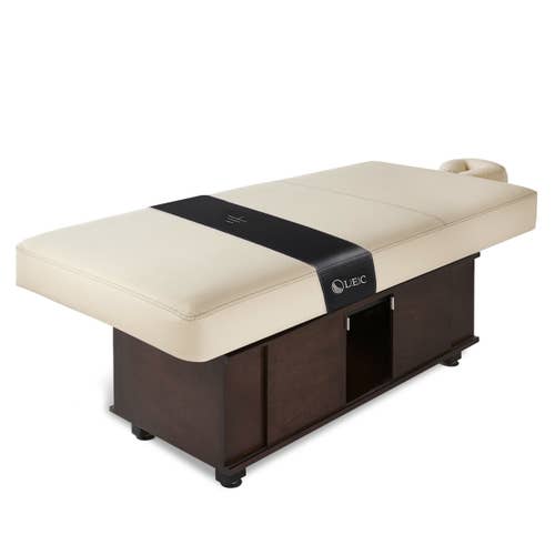 Living Earth Crafts INSIGNIA 2.0 Classic spa table with cushioned top, dark wood base, headrest.