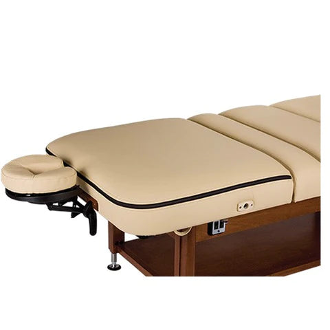Beige EarthLite ELLORA LIFT Massage Table with wooden base, adjustable headrest, side view.