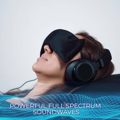 Woman relaxes on Living Earth Crafts Mind-Sync 2.0™ Lounger, enjoying vibro-acoustic therapy.