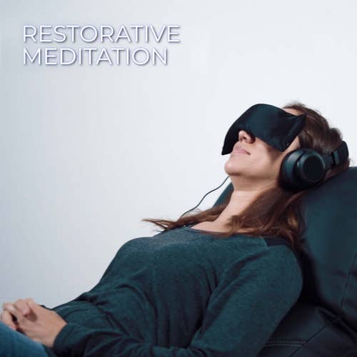 Woman reclines on Living Earth Crafts Mind-Sync 2.0™ Wellness Lounger; Restorative Meditation.