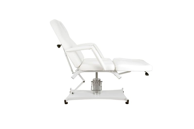 Side view of Silverfox America 2206A Hydraulic bed, white with armrests on metal base.