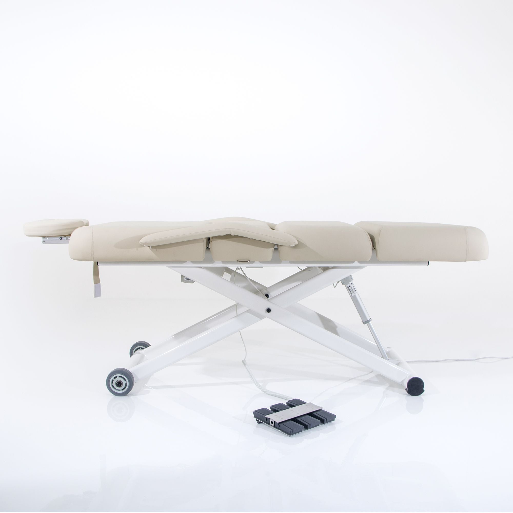 Silverfox America 2274B ADA electric massage bed with wheels and foot pedal, beige, shown on white.