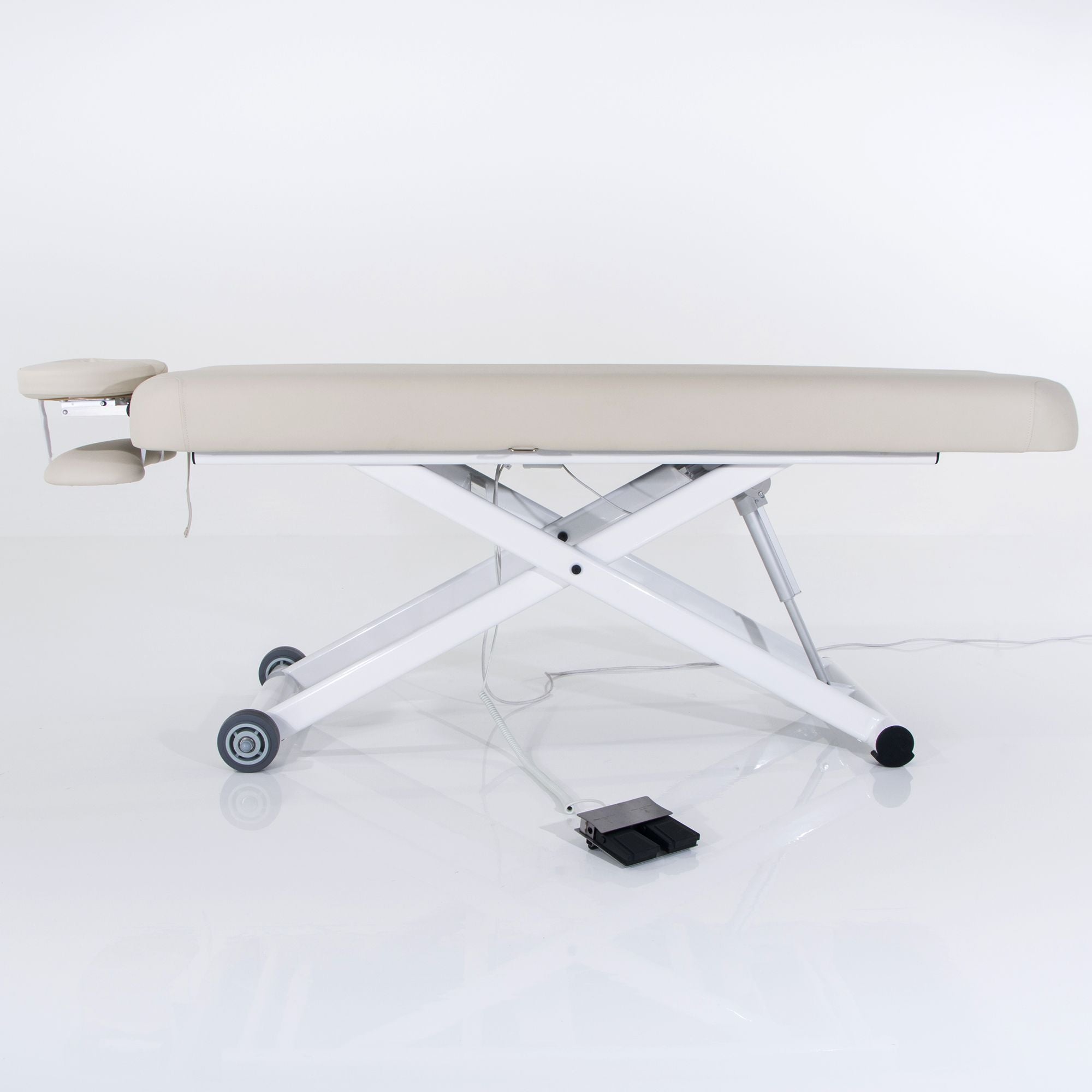 Silverfox America 2274 Electric Massage Table with cream padding and metal base, side view.